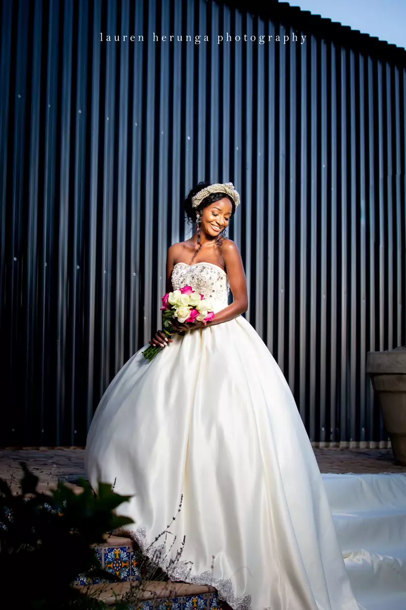 Bride in a white wedding gown holding a bouquet