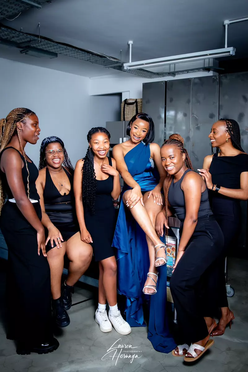 Six young women posing together
