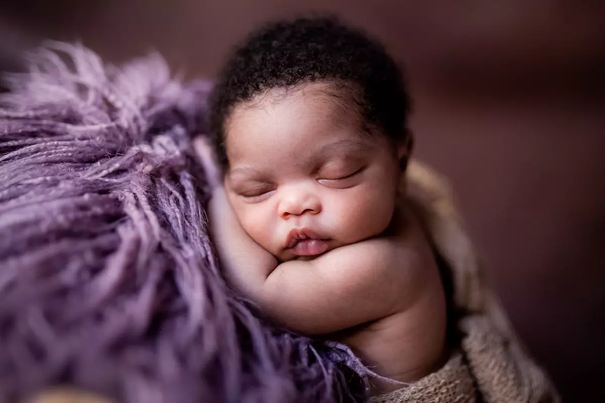 Sleeping newborn baby, close-up portrait