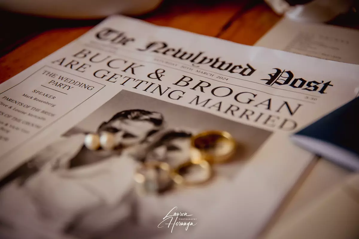 Custom wedding newspaper featuring a couple's photo and wedding rings
