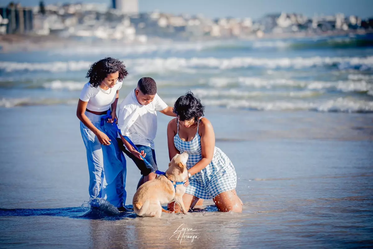 Family on beach with dog