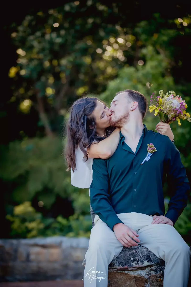 A couple kissing outdoors